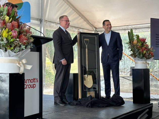 At the official commissioning of Arnott's automated distribution centre at its Huntingwood site in Western Sydney. L-R: Member for Prospect Dr Hugh McDermott and Arnott's CEO George Zoghbi, unveiling the golden shovel presented to the company by project builder, FDC Construction and Fitout.
