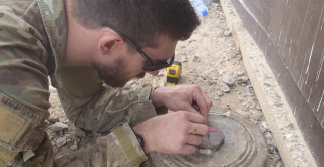 Chief Petty Officer (ret&rsquo;d) Ashley Semmens defusing a Russian mine during his deployment to Afghanistan. 

Credit: Ashley Semmens