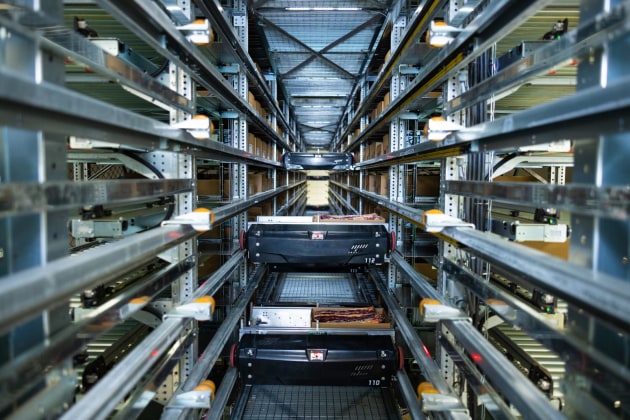 MHM&rsquo;s solution for Midfield include a Six-Mag Carton Lidder to automatically places and seals lids on cartons; an SSO Plate Freezer,  each with capacity to freeze 3072 cartons in 24 hours; an Automated Storage and Retrieval System (ASRS) (pictured), for chilled and frozen products, and a Three-Cell Robotic Palletising System with auto-check scanning, stretch wrapping and labelling.