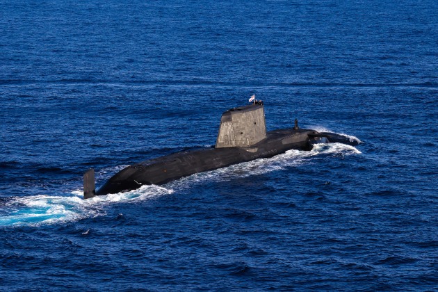 A rare appearance on the surface for an Astute-class submarine accompanying a Royal Navy Carrier Strike Group. (Royal Navy)