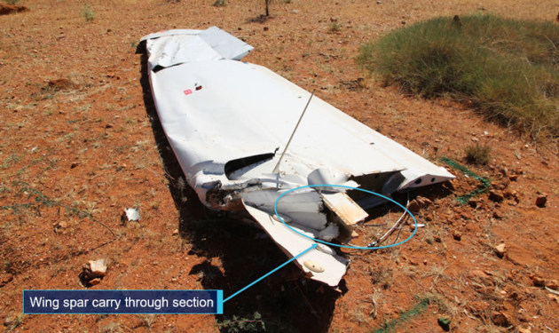 The wing of VH-SUX showing the fractured carry-through spa. (ATSB)