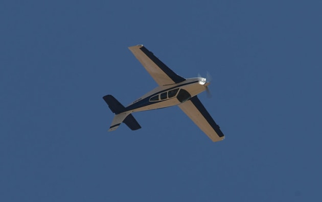 Can you do that with a Bonanza? This E33C piloted by Jock Folan proves that you can. (Steve Hitchen)
