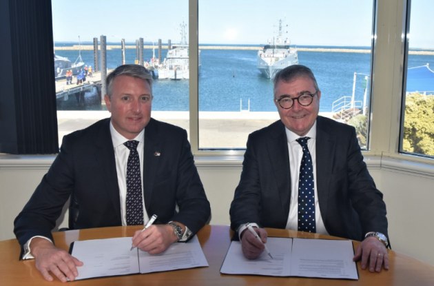 Austal CEO Paddy Gregg and Deputy Secretary Naval Shipbuilding and Sustainment Jim McDowell signing the Heads of Agreement at Henderson on 23 November 2023.
Credit: Austal