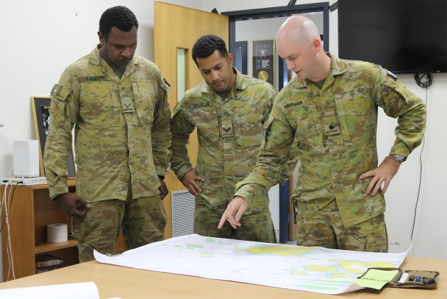 Major Freeman briefs members of C Company, 51st Far North Queensland Regiment.
Credit: Mike Yeo