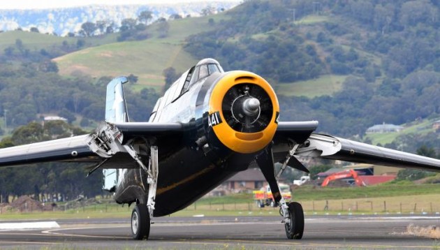 Paul Bennet demonstrates the wing folding mechanism on the TBM Avenger. (Steve Hitchen)