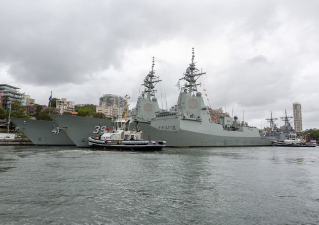 HMAS Hobart berths alongside her sister ship HMAS Brisbane at Fleet Base East.
Defence