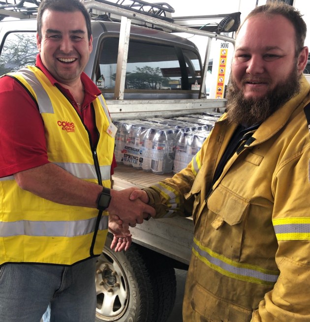 Coles site manager Taree Ben Elliot donating goods to Lansdown Bushfire Brigade.