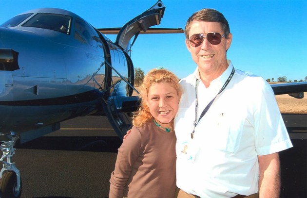 Angel Flight founder Bill Bristow with one of many children his organisation has helped over the years. (Angel Flight)