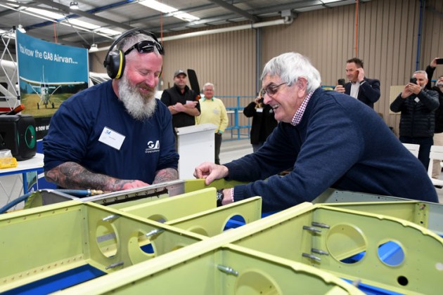 In it goes! George Morgan lends a hand as Daniel Blake drives the first rivet into the floor structure of Airvan #263. (Steve Hitchen)