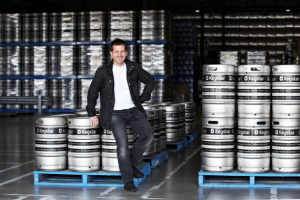 Kegstar founder Adam Trippe-Smith with some of the company's stainless steel kegs.