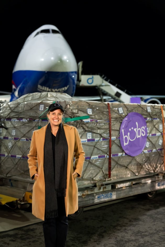 Bubs Australia founder and CEO Kristy Carr with the first shipment of formula headed to the US. (Image source: Bubs Australia)
