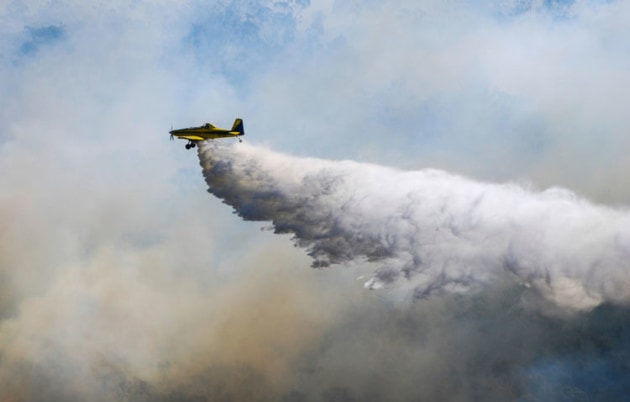 Single-engine aerial tankers (SEAT) can change direction rapidly an unpredictably on firefighting operations, creating a need for GA and drone pilots to stay well clear of bushfire boundaries. (CASA)
