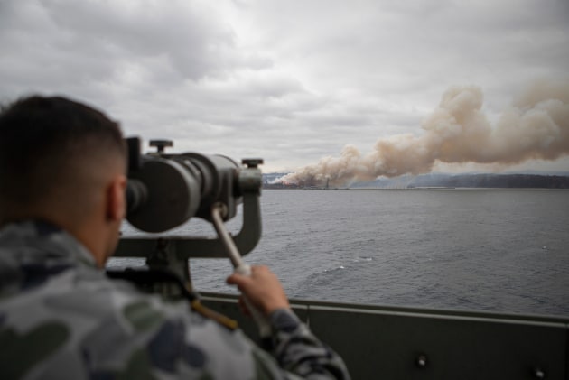 The town of Eden burning, as seen from HMAS Adelaide.
Defence