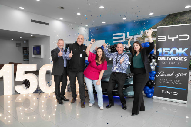 BYD delivers its 150,000th vehicle in Australia to a delighted customer from BYD Warrnambool on Victoria&rsquo;s south-west coast.  (LtR): Paul Ellis, BYD Australia Public Relations Director; Scott Moysey, BYD Warrnambool co-Dealer Principal, 150,000th customer Tiffany, Steve Callaghan, BYD Warrnambool co-Dealer Principal; Meaghan Hoelzl, BYD Australia Southern Regional Sales Manager.