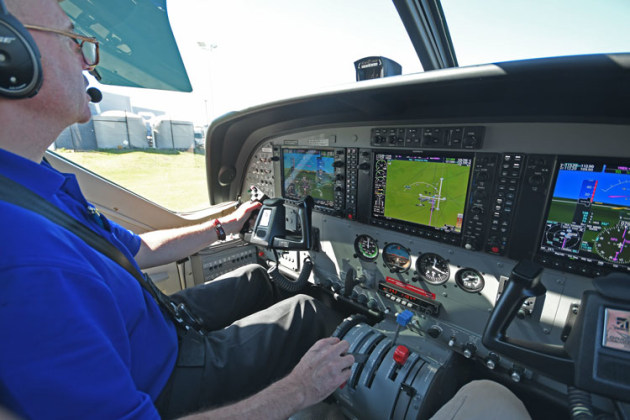 James Wilson in the office. The test aircraft was fitted with three Garmin 1000 screens. Note also the inertial separator handle just below the back-up ASI. (Steve Hitchen)
