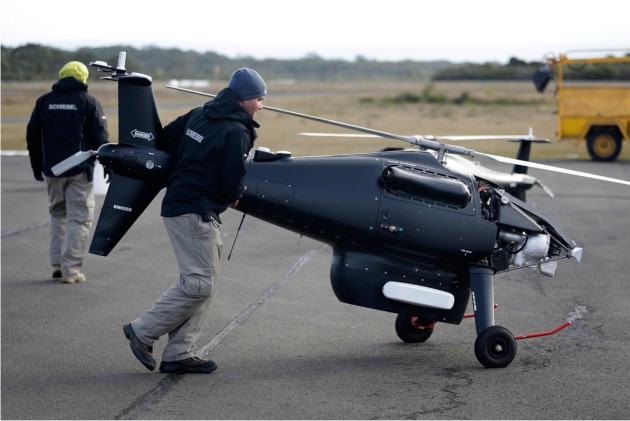 Ground crew prepare the Schiebel S-100 Camcopter UAS for flight at Jervis Bay.
Defence