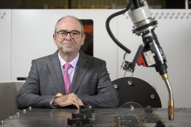 Managing Director of Rowlands Metalworks, Cameron Johnston, with the new 3D welding robot. (Credit: Rowlands Metalworks/Simon Casson)