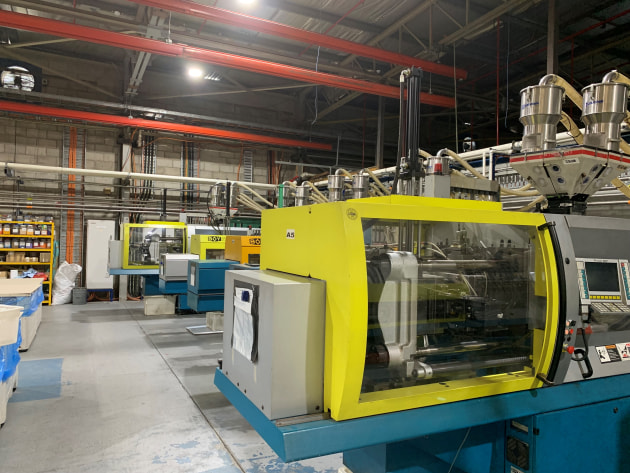 A section of the cap blow-moulding production line at Impact International.