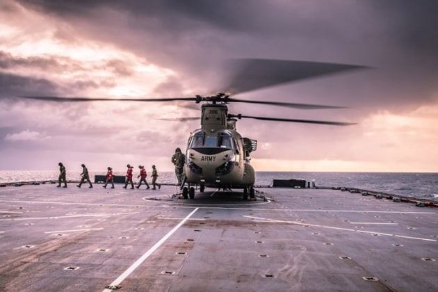 HMAS Choules flight deck team conduct flight deck operations during CH-47 first of class flight trials in the Coral Sea. Credit: LEUT Grant Thaler/Defence