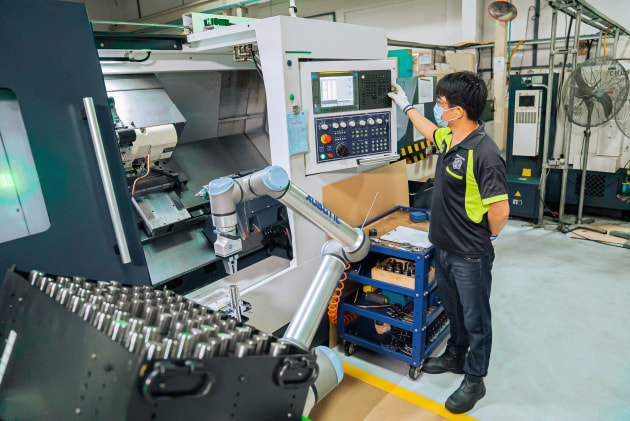 A well-functioning manufacturing workflow relies on machinery consistently being loaded and unloaded with parts or materials.