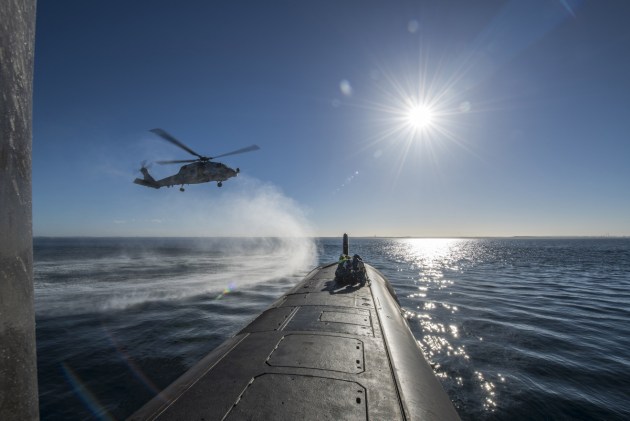 A Seahawk helicopter conducts a forward passenger transfer with HMAS Rankin inside Cockburn Sound, WA.
Defence