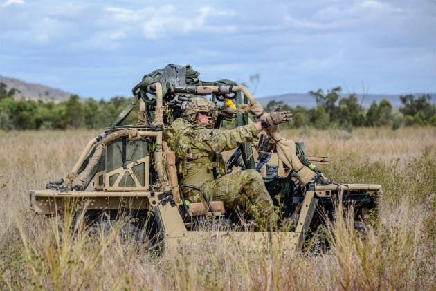 Soldiers from 2nd Commando Regiment drive their all-terrain vehicle near Townsville during Exercise Talisman Sabre.
Defence