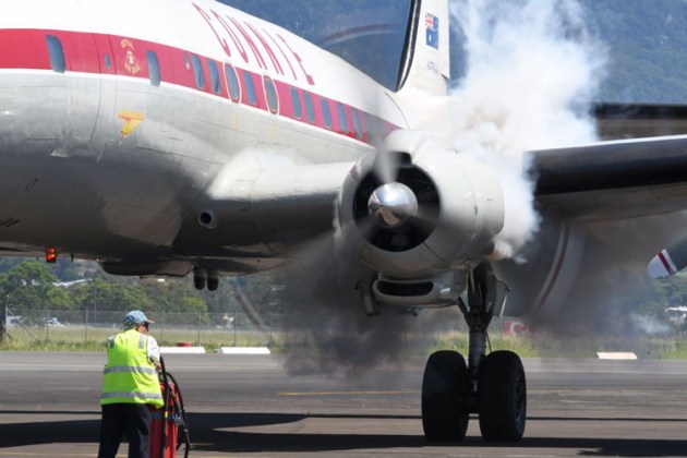 Smoke belches from the port inner of the Super Constellation an the HARS team prepares to taxy. (Steve Hitchen)