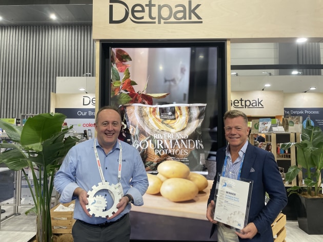 Winners: Detpak's Mark Rohrlach and Romano Bolzon show off the new award on the stand at APPEX, with the winning pack pictured behind.