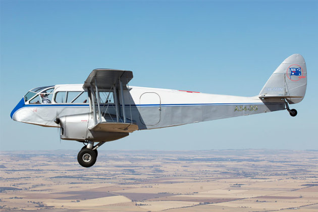 VH-AON is a newly-restored de Havilland Dragon that our cameraman caught in flight. (Phil Hosking)