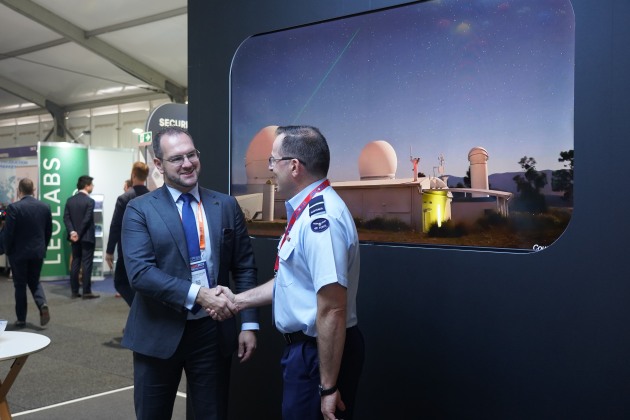 Air Commodore Joe Medved and General Manager of the Office of the Space Regulator at the Australian Space Agency, Christopher De Luis, shake hands following the MoU signing at the Avalon Airshow. (ADM/Roya Ghodsi)