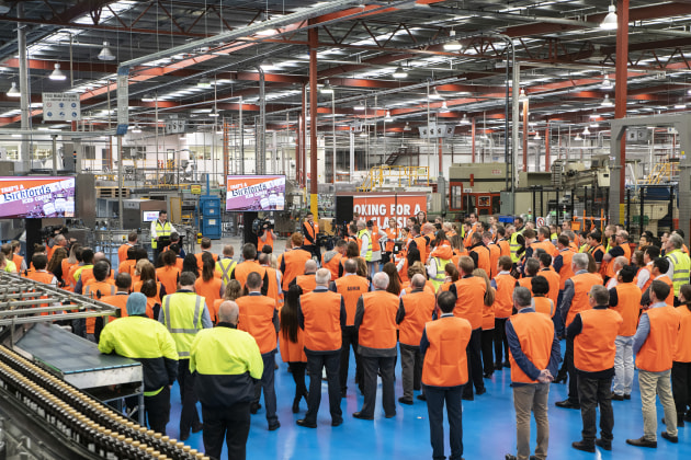 Staff gather to listen to speeches at the opening of Bickford's $20 million new facility.