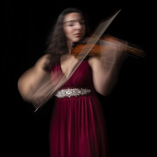 This portrait of Elle was made using the Amaran 300C in continuous white light mode (5200K); it had a small soft box attached and was placed to the left of the subject. To capture the movement I placed the camera on a tripod and asked Elle to move as she played her violin. Nikon Z6 III, VR 70-200mm f/2.8E lens @ 105mm. 1/4s @ f8, ISO 100