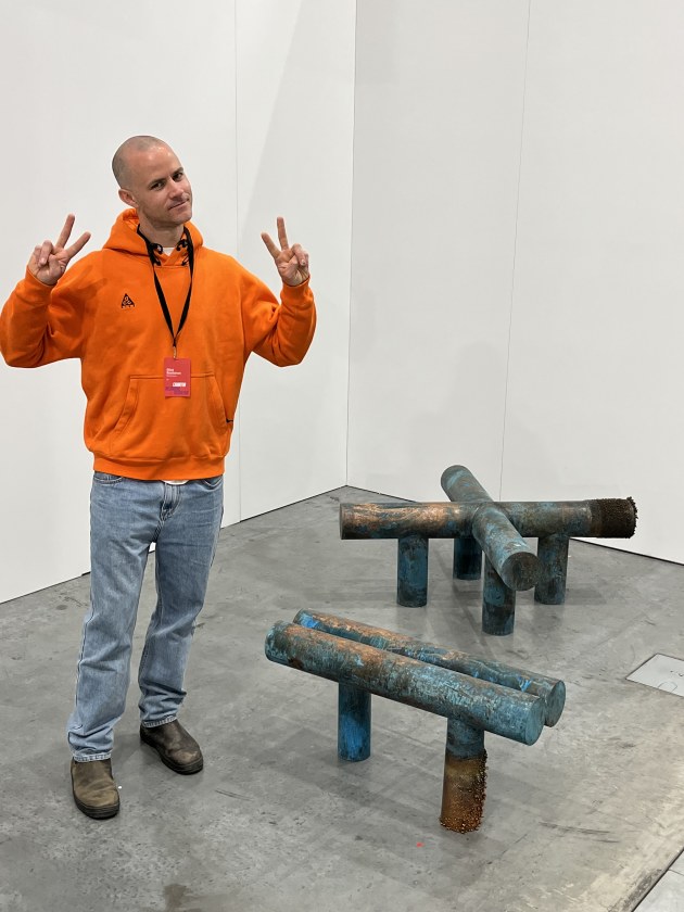 Elliott Bastianon with his patinated copper bench seat sculptures. The finish is achieved through a lengthy and progressive electroplating process.