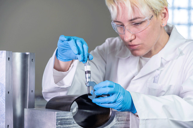 Composites Engineer at ACS-A inspecting ultra-high temperature composites part. Credit: ACS-A