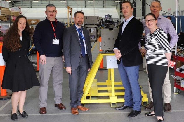 Dr Warwick Holloway, President EOS Defence Systems Australia, pictured with the CASG Team at the EOS Hume facility. Credit: EOS