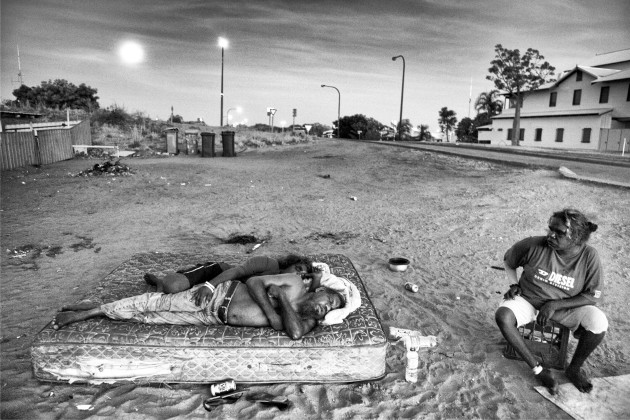 Jackie and Geraldine sleeping on a mattress in front of their house in Kennedy Hill. 'We like to sleep here as there's a nice breeze. Inside the house it's too hot. This is how we live." Audrey (R) just woke up. Kennedy Hill, Broome, Western Australia. &copy; Ingetje Tadros.
