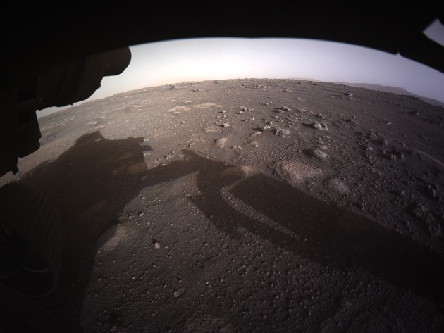 The first high-resolution, colour image to be sent back by the Hazard Cameras (Hazcams) on the underside of NASA&rsquo;s Perseverance Mars rover after its landing. (Supplied: NASA/JPL-Caltech)