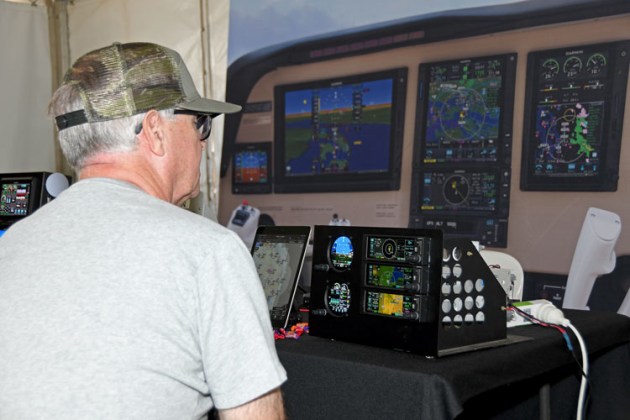 Checking out the latest avionics innovation and technology from Garmin. (Steve Hitchen)