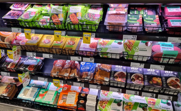 Plant-based meats on supermarket shelf.
