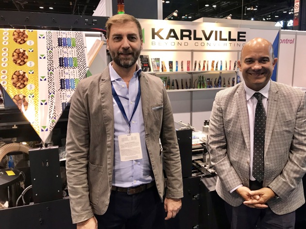 Gustavo Guzzi EMEA sales manager, Karlville and Raul Matos, VP , Karlville (represented in Australia by Currie Group) in front of the company's new pouch converting line launched at Pack Expo 2018, a machine which Matos claims will be a true 'game changer'. Key USPs include that it is only eight metres in length and uses 24 metres of material in any pouch job set-up, which also only takes 30 minutes.