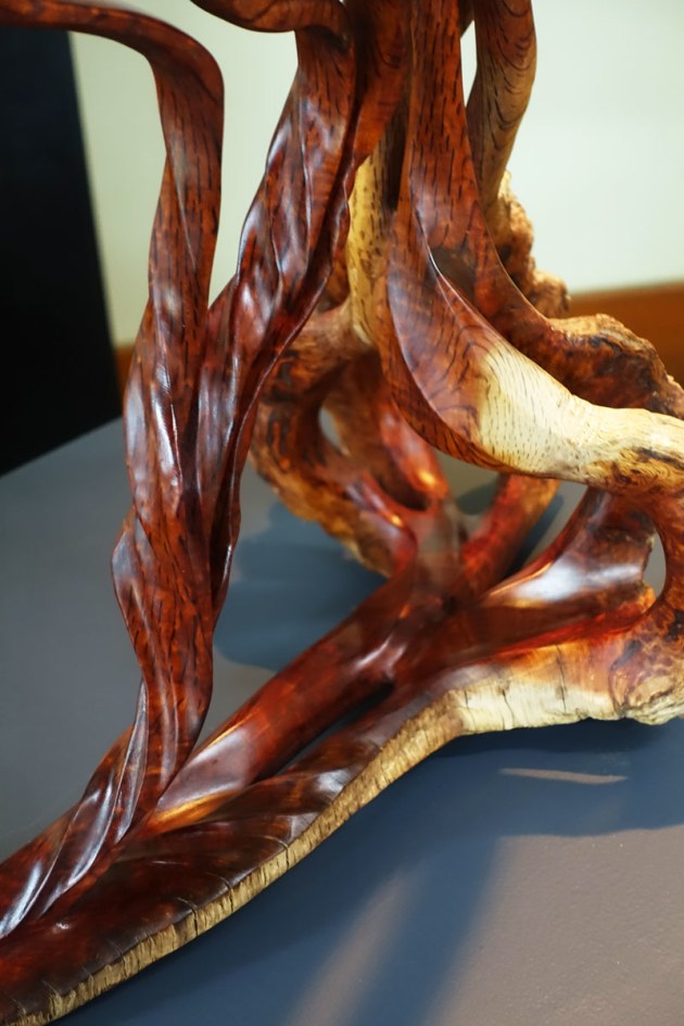 Guy Breay, Forest Fantasy, old flame sheoak. "On the floor of the forest, an old vine clings to life with gnarled roots. Younger vines twist upward and merge into two strands at the top of the forest. At this point, they arch over under their own weight and remain in suspension.  Look carefully and you may get a fleeting glimpse of a fairy dangling by her feet. Her hair flows down to the forest floor to continue the cycle of life."