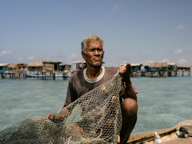 A local Bajau Laut fisherman off Denawan Island. &copy; Mark Lehn.