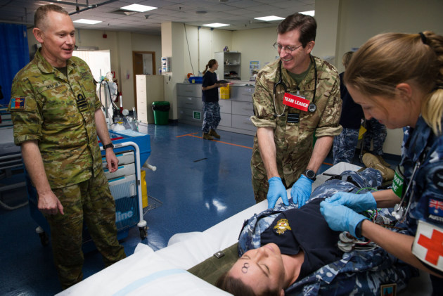 Commander Neil Smith, of Navy Health Services, monitors a mass casualty exercise at the Camp Baird Role 1 Medical Facility. Defence