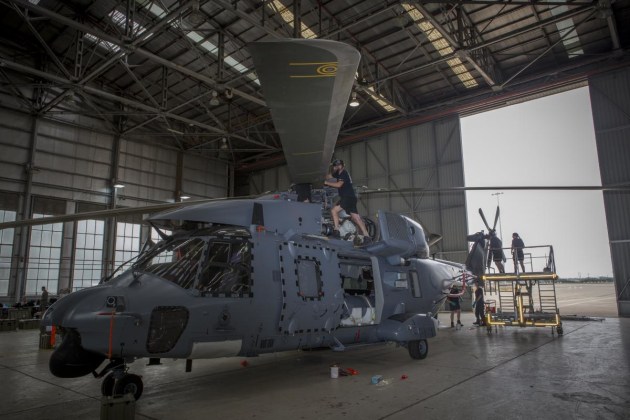 RNZAF Corporal Damo Herlihy prepares the main rotors on an NH90 at RAAF Base Richmond in preparation to help with the bushfire efforts.
Defence
