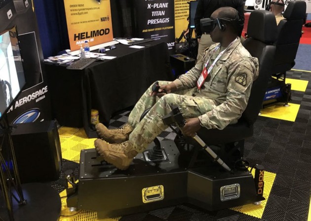 A US Army soldier evaluates Ryan Aerospace's Helimod III virtual reality simulator. (Ryan Aerospace)