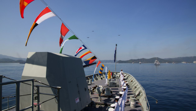 HMAS Anzac sailors line the decks for fleet inspection at Lombok, Indonesia.
Defence
