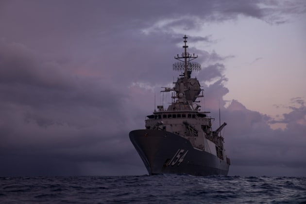HMAS Parramatta during training exercises on the Coral Sea at dawn.
Defence