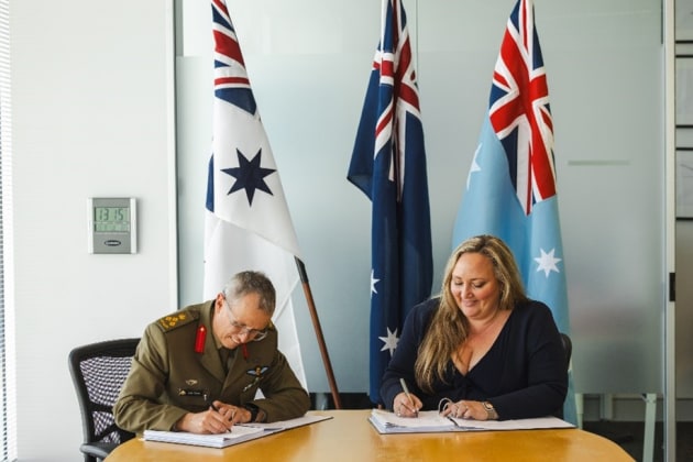 SYPAQ  CEO Amanda Holt signs the Project Defence 129 contract. 

Credit: SYPAQ Systems