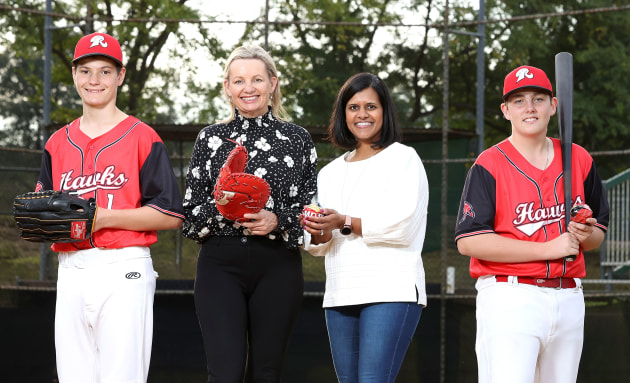 Pip Kiernan, chair of Clean Up Australia, and Vandita Pandey, CMO PepsiCo ANZ, with Ryde Hawks Baseball club players.