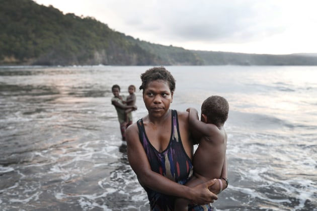 &copy; Lisa Maree Williams. Young women from the village of Waisisi cool off in the Pacific Ocean on the island of Tanna, Vanuatu.
Scientists have forecast that the strength of South Pacific cyclones will increase due to global warming and
satellite data shows sea level has risen at a rate nearly twice the global average. Vanuatu&rsquo;s government is considering options to sue the world&rsquo;s major pollution emitters in a radical effort to confront global warming challenges and curb global emissions.